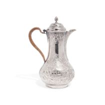 A GEORGE II SILVER REPOUSSÉ COFFEE POT by Thomas Whipham and Charles Wright, London, 1757