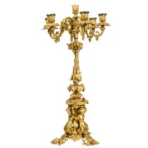 A ROCOCO STYLE GILT BRONZE SEVEN-LIGHT CANDELABRAEarly 20th century