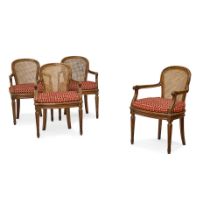 FOUR LOUIS XVI STYLE UPHOLSTERED CANED AND CARVED MAHOGANY FAUTEUILS19th century