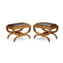 A PAIR OF CONTINENTAL NEOCLASSICAL STYLE GILTWOOD CURULE STOOLS