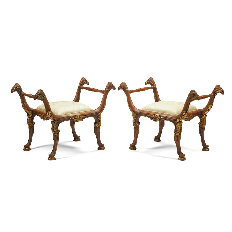 A PAIR OF CONTINENTAL ROCOCO STYLE CARVED PARCEL GILT BENCHES