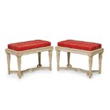 A PAIR OF NEOCLASSICAL STYLE CARVED PAINTED WOOD UPHOLSTERED BENCHES