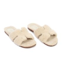 Hermès: a Pair of Men's Ecru Shearling Izmir Sandals