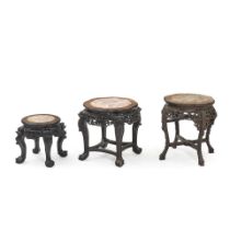 THREE CHINESE CARVED HARDWOOD AND MARBLE TOP STANDS