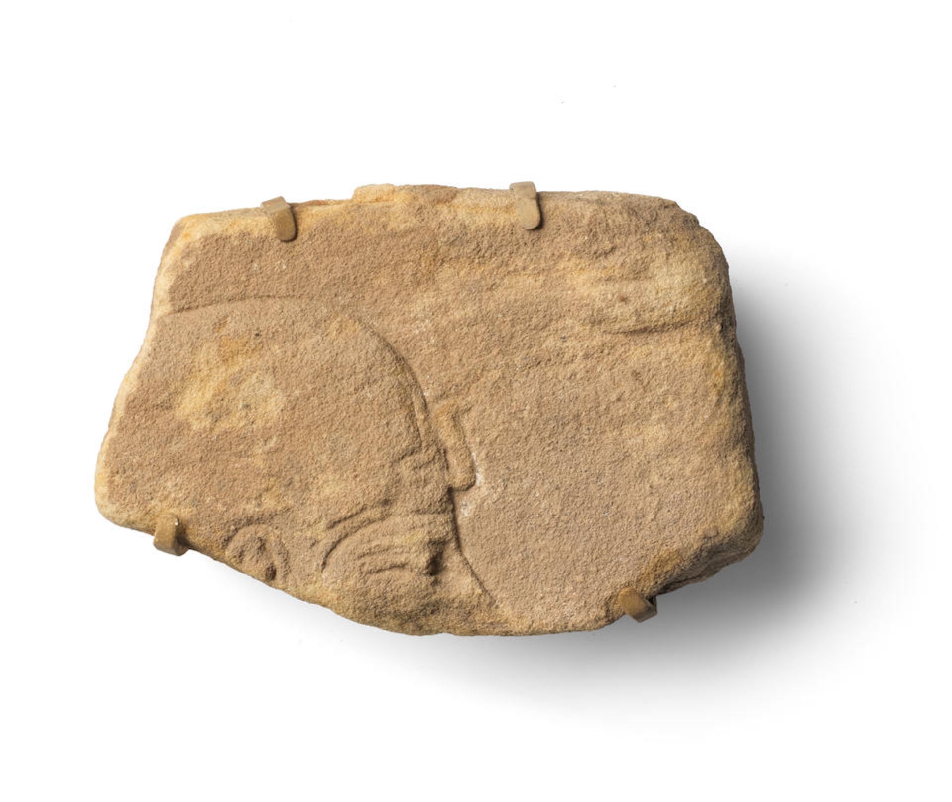 An Egyptian sandstone relief fragment
