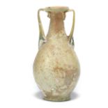 A Roman green glass amphora