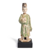 A POTTERY FIGURE OF A STANDING OFFICIAL,