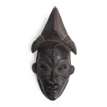 AN AFRICAN-STYLE CEREMONIAL MASK,