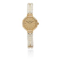 Longines. A lady's 18K gold diamond set quartz watch with pearl set bracelet Circa 1990
