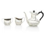 A matched Silver Three Piece Coffee Set By Hukin & Heath, Birmingham, the coffee pot 1896, the s...