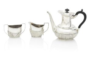 A matched Silver Three Piece Coffee Set By Hukin & Heath, Birmingham, the coffee pot 1896, the s...