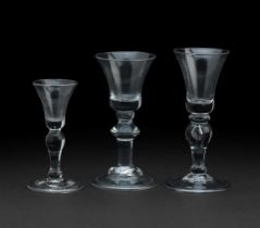 Two 18th century baluster glasses and a gin glass circa 1725