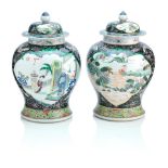 A pair of Chinese famille noir baluster vases and covers Kangxi six character marks but of 19th ...