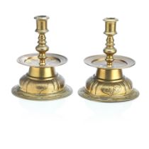 A pair 17th century style brass candlesticks