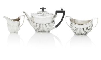 A Victorian three-piece silver tea service By Roberts & Belk, Sheffield, 1884, the sugar bowl 18...