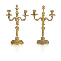 A pair of late 19th early 20th century French ormolu gilt brass two light candelabra (2)