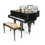 An ebonised baby grand piano, made by C. GoetzeFirst seen in Season 6, in the Diana Kensington P...