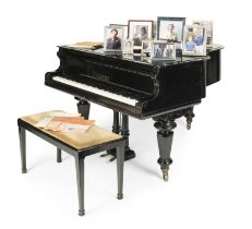 An ebonised baby grand piano, made by C. GoetzeFirst seen in Season 6, in the Diana Kensington P...