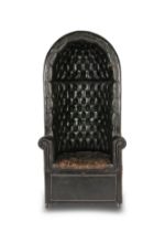 An early 20th century black leather close-nailed upholstered porter's chairFirst sourced for Sea...