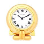 Cartier. A gilt brass quartz desk clock with alarm Colisee, Circa 2000