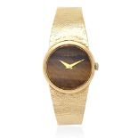Bueche-Girod. A lady's 9K gold manual wind bracelet watch with tiger's eye dial London Hallmark ...