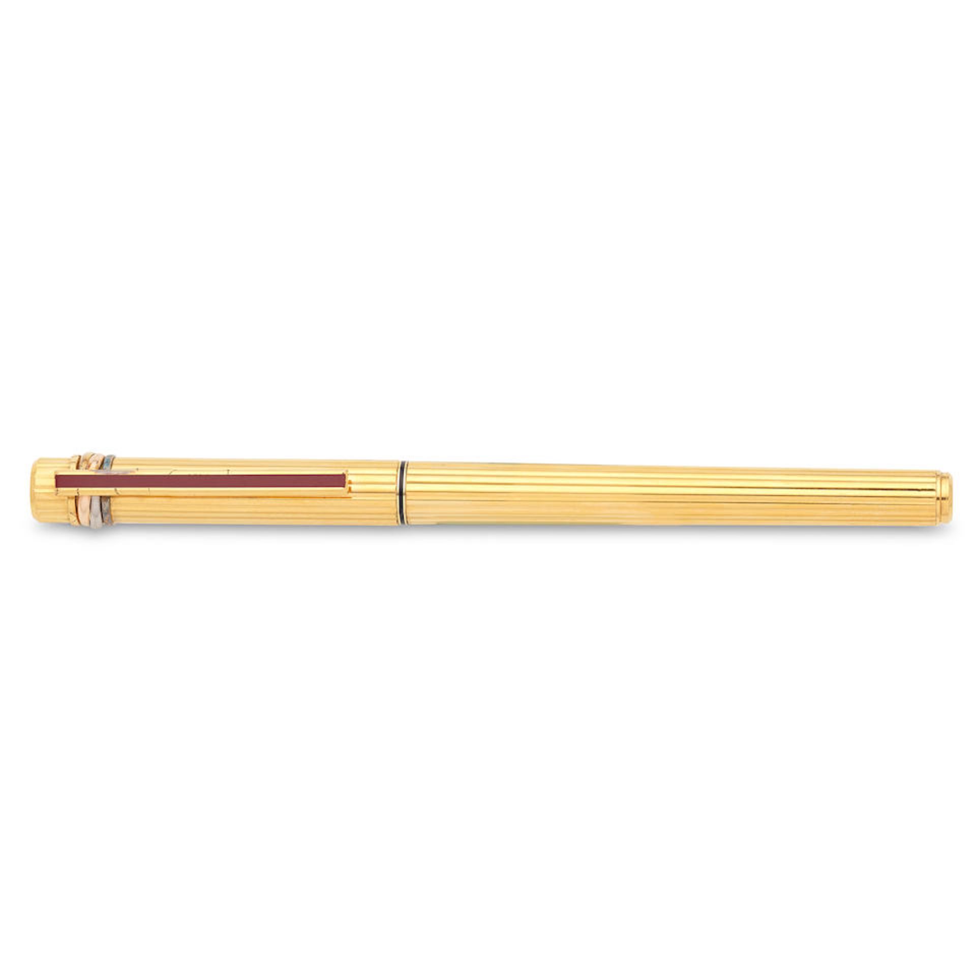 Cartier. A gold plated fountain pen with red lacquer Trinity, Circa 1990 - Image 3 of 4