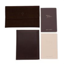 Patek Philippe. A tablet case, leather document folder with pen and two notebooks (4) Various dates