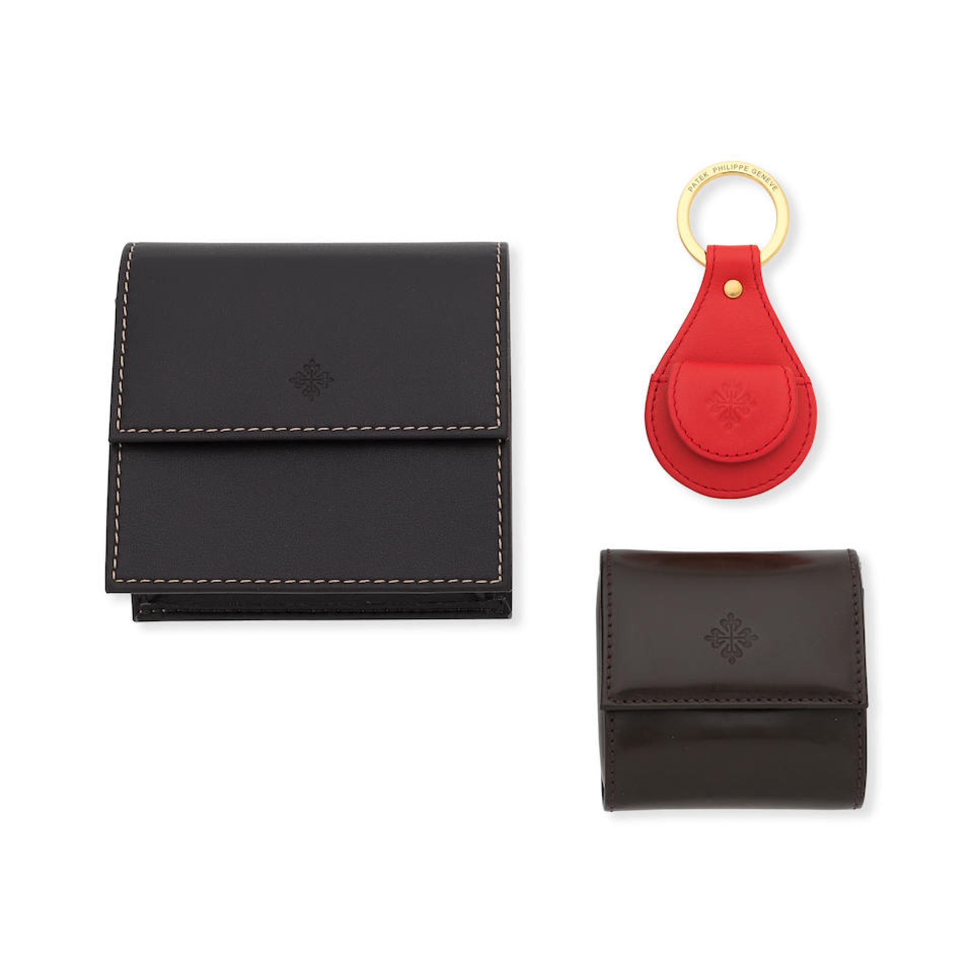 Patek Philippe. A cufflink case, service delivery case and red keyring (3) Various dates