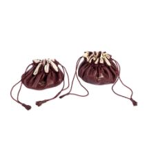 Patek Philippe. A lot of two burgundy drawstring watch holders (AF) (2) Circa 1990