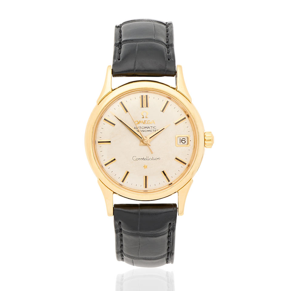 Omega. An 18K gold automatic calendar wristwatch Birmingham Hallmark for 1961