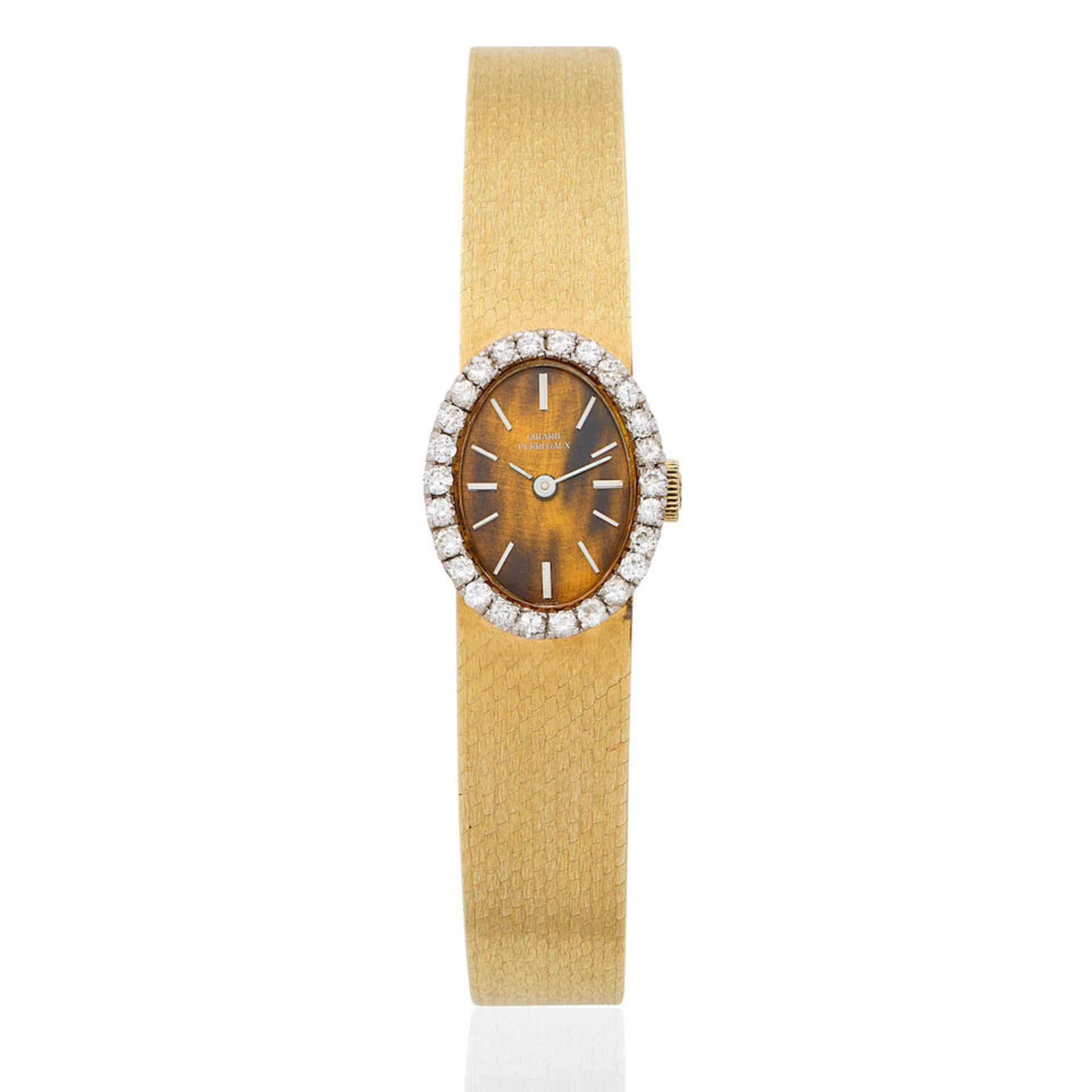 Girard-Perregaux. A lady's 18K gold and diamond set manual wind bracelet watch with tiger's eye ...