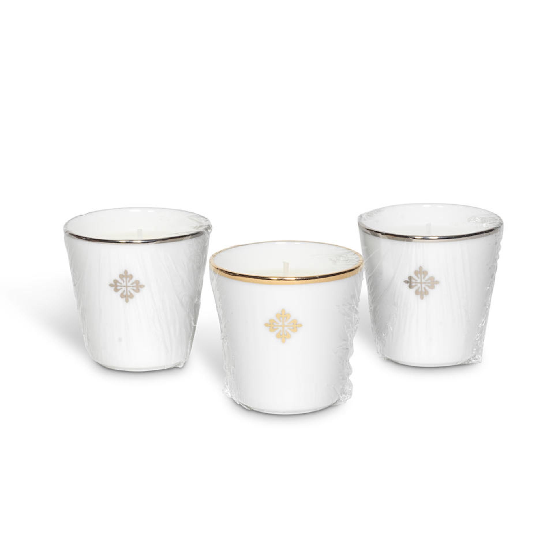 Patek Philippe. A boxed set of three candles Circa 2020