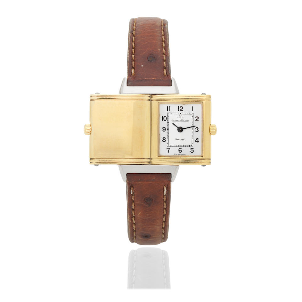 Jaeger-LeCoultre. A lady's stainless steel and gold quartz reversible rectangular wristwatch Re...