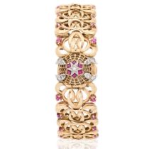 Jaeger-LeCoultre. A lady's 9K gold diamond and ruby set manual wind bracelet watch with conceale...