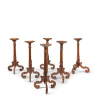 A set of six Dutch walnut and yew wood candle stands (6)