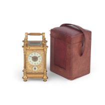 A late 19th century French lacquered brass carriage timepiece with alarm