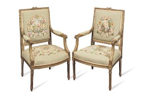 A pair of early 20th century fauteuils in the Louis XVI style (2)