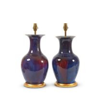 A pair of Chinese lavender and sang de boeuf glazed baluster vases later adapted as lamp bases t...