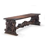 A large Italian 19th century Baroque revival walnut trestle or dining table