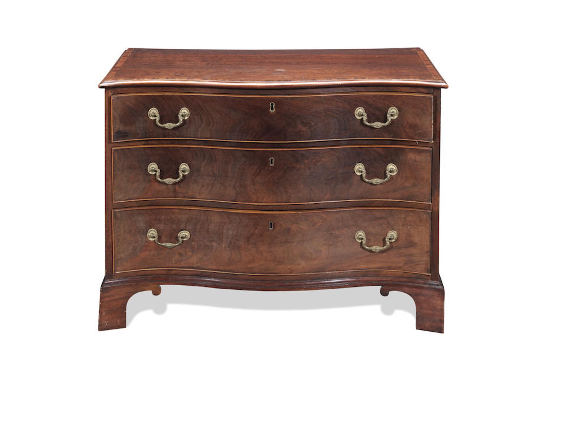 A George III mahogany serpentine chest of attractively low proportions