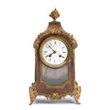 A late 19th century French gilt bronze mounted red stained 'boulle' marquetry mantel clock toget...