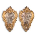 A pair of Continental gilt and silvered gesso and carved wood and gilt metal twin light wall app...