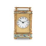 An early 20th century French gilt brass and champleve enamel miniature carriage timepiece