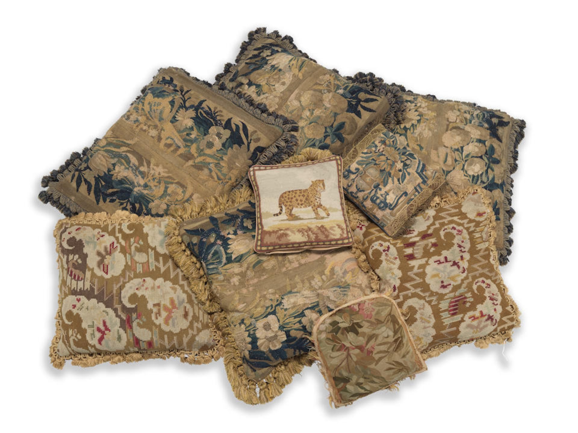 A group of 17th Century Flemish tapestry border fragments made up as cushions (9)