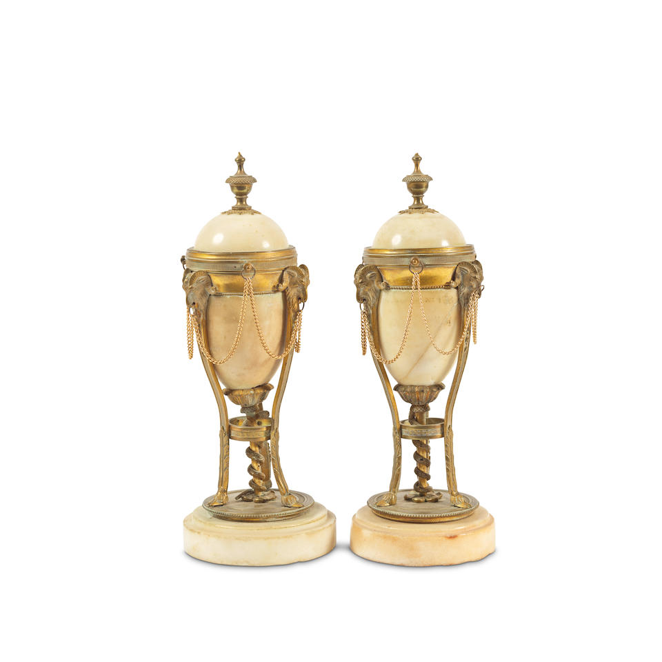 A pair of 19th French century marble and gilt bronze mounted cassolettes in the Louis XVI style (2)