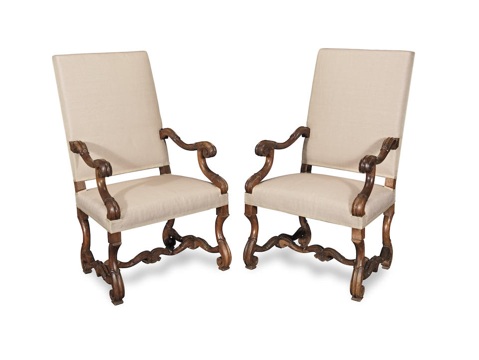 A pair of French walnut fauteuils or armchairs in the Louis XIV style Apparently late 19th/early...