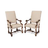 A pair of French walnut fauteuils or armchairs in the Louis XIV style Apparently late 19th/early...