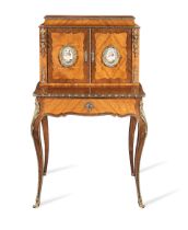 A Napoleon III porcelain and ormolu mounted tulipwood and rosewood bonheur du jour