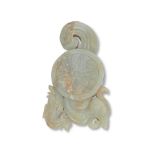 A Chinese pale green and russet jade 'Double Phoenix' carved fitting Late Qing dynasty or later