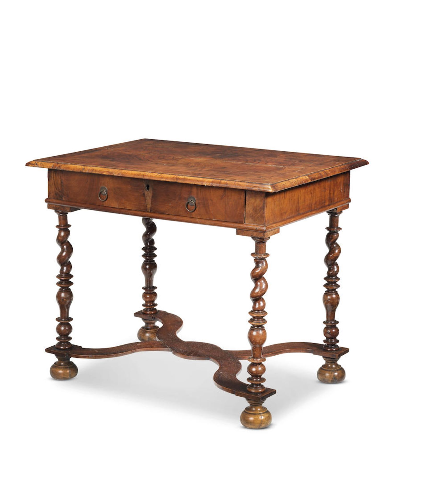 A walnut side table largely late 17th/early 18th century; the legs and stretcher probably associ...
